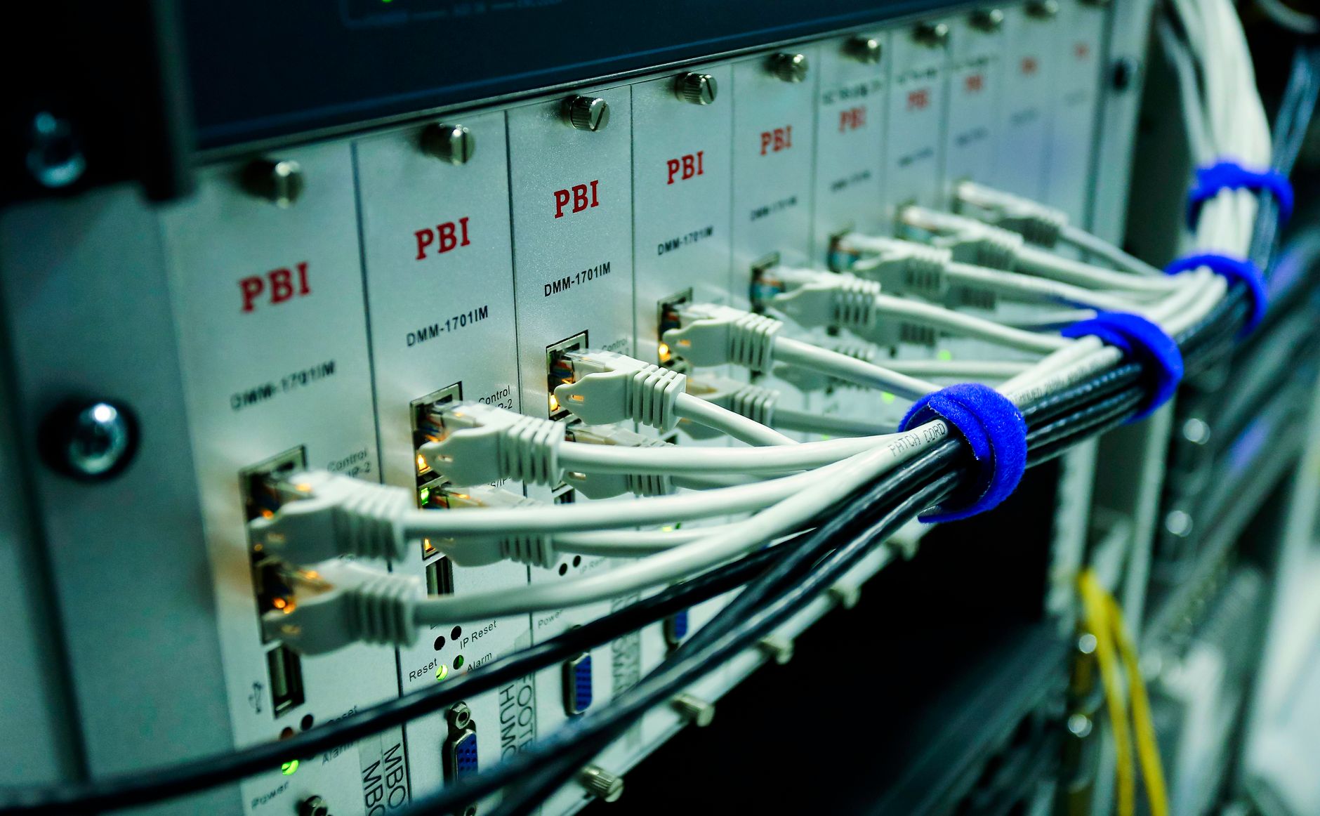 Neatly bundled network cables running into a server rack